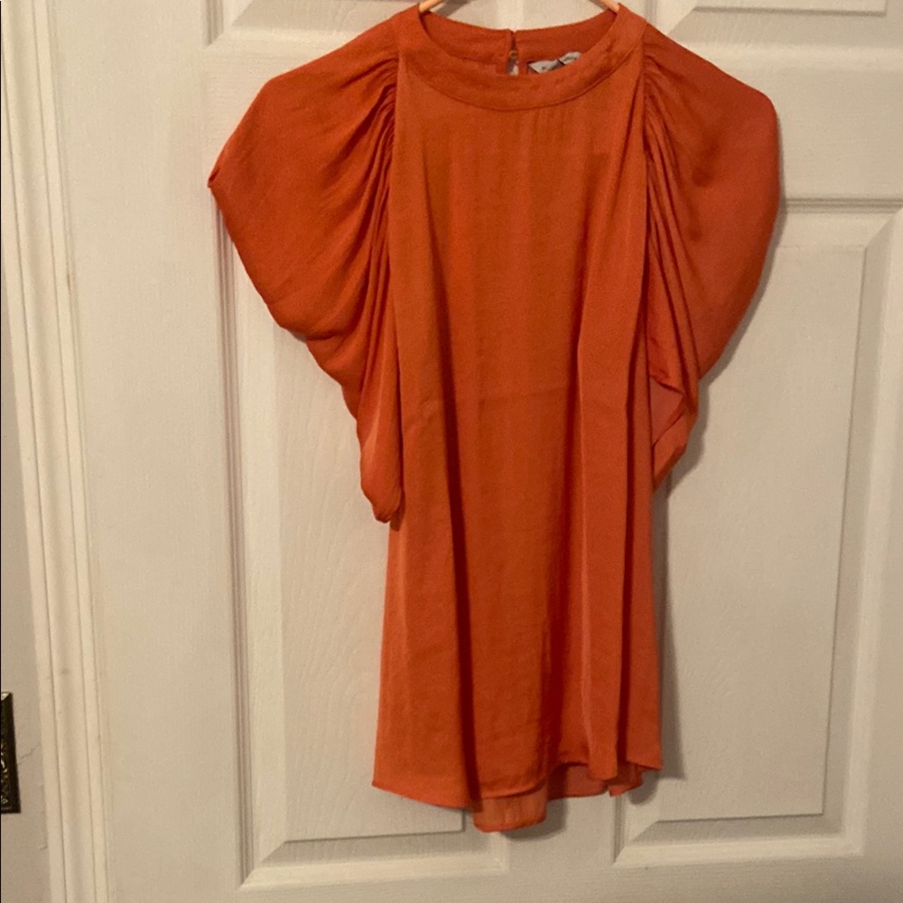 Vibrant Orange Blouse with Elegant Design